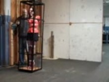 Caged in tight bondage
