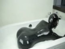 Rubber Pet Girl Taking a Bath