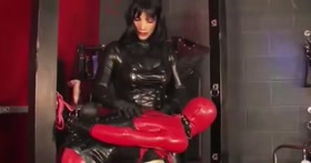 Rubber sissy sucking cock