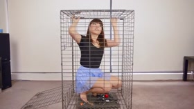 Closing Herself Into Cage